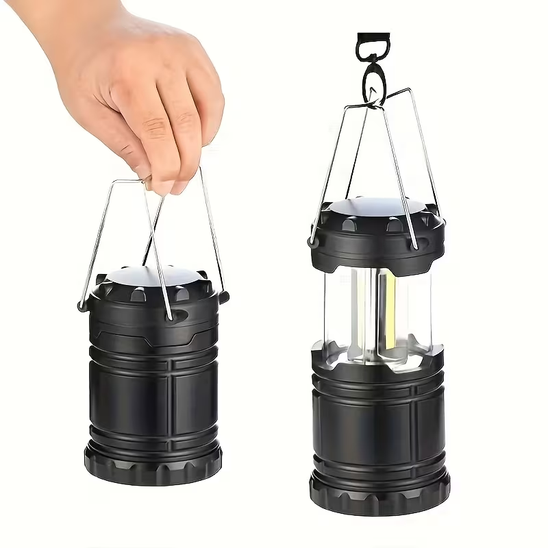 Lámpara LED COB negra para camping, plegada y extendida, con asas de transporte